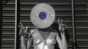 sexy disco woman painted in silver body paint with an amazing diamond crystal record vinyl as a head