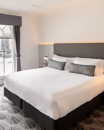 Your perfect city getaway awaits at The Savoy Hotel on Little Collins. Step into your room and unwind as you enjoy gorgeous city views, comfortable bedding, and a sleek modern ensuite. Book your stay now. savoyhotelmelbourne.com | The Savoy Hotel on Little Collins Melbourne