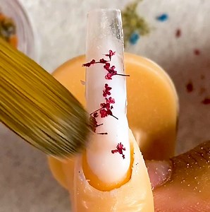 'Milk bath' nails use real dried flowers. | Insider Beauty