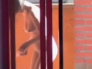 Neighbor spied through window shaving - watch on VoyeurHit.com. The world of free voyeur video, spy video and hidden cameras