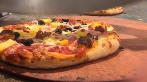 13 reactions | There’s nothing more satisfying than slicing a fresh and hot pizza  ‍ | Firehouse Pizzeria Logan | Facebook