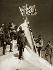 The German Army raises the Imperial War Flag on top of Mount Elbrus Ethereal footage of Special Mountain Troops of the German Wehrmacht (Army) climbing Mount Elbrus on 21 August 1942 and planting the Third Reich War Flag on top of the loftiest peak in Europe, along with the flags of the 1st and 4th Mountain Divisions. This is symbolically considered as the acme of the Third Reich’s power during WWII. | Circassian Culture and Folklore