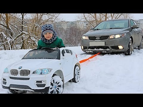 FUNNY BABY Stuck in the SNOW! Kid ride on POWER WHEEL Towing car BMW Funny cars video for kids