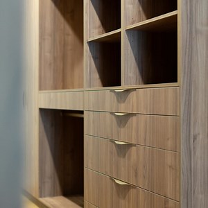 Open plan walk-in closet with dark wood and gold hardware…say no more 😍 #design #wardrobe #cabintry #designer #interior #interiordesigninspo #luxuryhomes #stroudhomes #moodyaesthetic #wardrobegoals | Stroud Homes