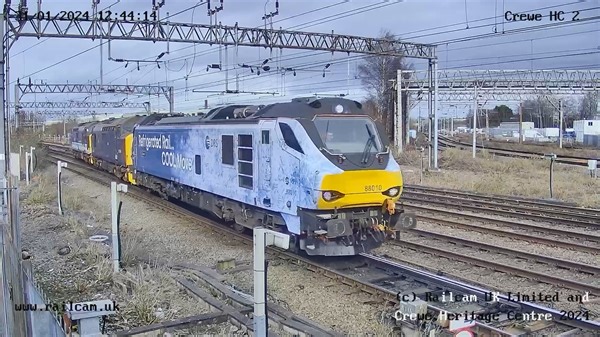 A last minute route change saw this convoy pass our Crewe station cameras, with Direct Rail Services #Class88 88010 'Aurora' escorting #Class37 37422 'Victorious' & 37425 'Sir Robert McAlpine/Concrete Bob' to Gresty Lane to await further developments after the fleet was stood down recently. | Railcam