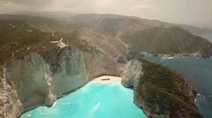 4K Aerial footage of Navagio Beach known as Shipwreck Beach or Shipwreck Cove located in Zakynthos island in Greece. Turquoise clean water with no tourist. Stock Video