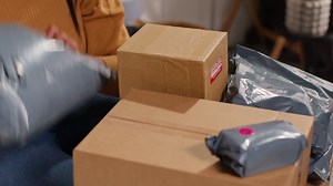 Woman Unboxing Packages at Home | Free Stock Video Footage