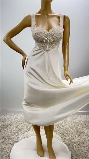 Sweet and sexy vintage lingerie. Mid length nylon nightgown with fitted bodice and flowing sweep.