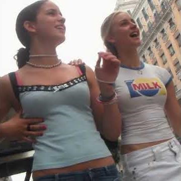 Two cuties walking through town with belly expanding