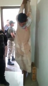 Iraqi Police Having Fun With A Suspect