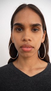 Our Large Pebble Hoop Earrings 🌿 A new design available in silver and gold plate. Model @tatyanaperry28 Beauty @teneillesorg #dinosaurdesigns #hoop #earrings | Dinosaur Designs