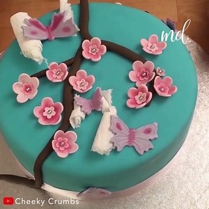 A cherry blossom decorated cake is so beautiful! | MetDaan Cakes