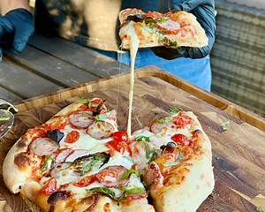 2.8K views · 80 reactions | Grilled Pizza in a GMG Pizza Oven | GrillinFools.com | Facebook