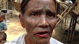 Women of the Chin tribe tattoo their faces at nine years old