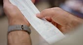 Hand, till slip and man holding finance document after buying or...