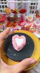 It’s easier to pipe more intricate designs when I decorate the cake in parts. I leave it for a few hours to set so I can layer on top of the piping without fear of smudging the previous decorations. The piping looks quite puffy and wet but it shrinks quite a lot so stay tuned to see the difference tomorrow when we finish decorating it! 🎂💝#ミニチュア #ミニチュアケーキ #handmade #粘土 #littlestsweetshop #miniature #pipingskills #pipingtechniques #miniaturist | Littlest Sweet Shop