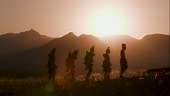 4K view of people from the Himba tribe in traditional dress, walking...