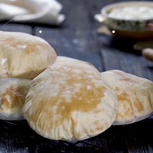 Homemade pita bread is a warm and fluffy delight that elevates your meals with its fresh, oven-baked goodness. #pitabread #homemade | Home Cooking Adventure