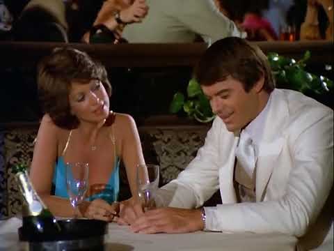 Phyllis Davis, braless cleavage in a blue silk gown—"Vega$"