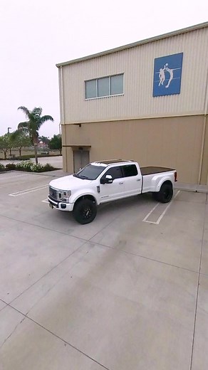 Who wouldn’t mind having this luxury tow rig in their garage? • 2022 Ford F-450 Platinum • Carli Suspension 2.5” “Pintop” Leveling System with Torsion Sway Bar System & Fabricated Radius Arms • King Shocks 2.5 Remote Reservoir Front Shocks & Piggyback Rear Shocks • (2) Rigid Industries Flush Mount SR-Q Pro Back-up Lights • 22” “Mesh” Forged Dually Design Co. Wheels in Gloss Black & Milled Finish • 37”x12.5” Nitto “Ridge Grappler” Tires | SoCal SuperTrucks