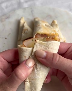 Deliciously Twisted: Try these mouthwatering Turkey Ham and Cheese Cone Wraps for a delightful snack or appetizer. The perfect combination of flavors wrapped in a crispy piadina shell – recipe by @maltesefoodlovers Turkey Ham and Cheese Cone Wraps Ingredients: Mission Piadina Wraps AiA Aequilibrium Petto di Tacchino Philadelphia Cream Cheese Chopped tomatoes Sliced or grated cheese Method: • Slice the wrap into four sections, both horizontally and vertically (as shown in the video). • Spread cre