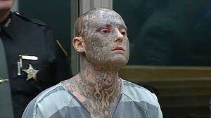 Tattooed suspect accused of assaulting officer arraigned Friday