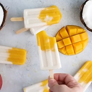 https://www.skinnytaste.com/simply-obsessed-frozen-coconut-mango/ These simple and super easy frozen ice pops are made with coconut milk and pureed mango, and I am OBSESSED. | Skinnytaste
