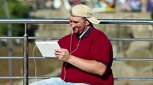 「Fat Man Uses Tablet Computer Man」の動画素材（ロイヤリティフリー）1007473312 | Shutterstock