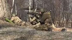 Footage reportedly taken with the Ukrainian army on Thursday appears to show troops near Kyiv fighting Russian forces.