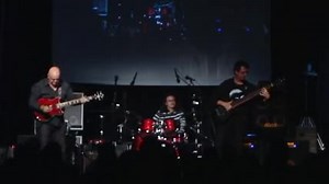 Alain Caron, Frank Gambale and Damien Schmitt close out All Star Guitar Night at Winter NAMM 2009 and blow the place up. Three standing ovations. Here's why. | TrueFire