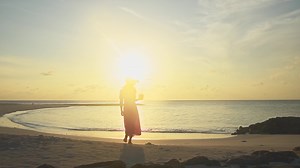 Download Close up Silhouette of beautiful attractive Young Girl Drinking Fresh Maldivian Coconut Cocktail at Tropical Beach. 4K, Slowmotion.Fulidhoo. Maldives luxury travel destination for free
