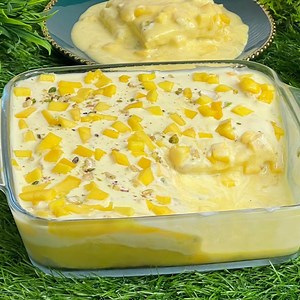 No Bake Mango Dessert With 2 Cups Of Milk | सिर्फ 2 कप दूध &15 मिनट में Mango Arabian Dessert Ingredients: 2 cup milk ( 500 ml ) ¼ cup sugar ¼ tsp cardamom powder 2½ tbsp custard vanilla or mango flavour 2 big mangoes ( 800-1000 g ) ( add sugar in mango puree if require ) 1 cup fresh cream ¼ cup condensed milk mango chunks dry fruits for garnishing ( optional 7-8 slices of bread or you may use vanilla cake Carote pan 24 cm: https://amzn.to/3wlMQmM carote handi 24 cm : https://amzn.to/3kojPE0 car