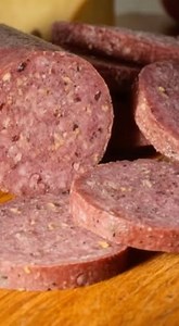 Homemade Summer Sausage Ingredients: 5 lb ground hamburger (no lean burger) 5 Tbsp liquid smoke (found near barbecue sauce) 5 Tbsp morton salt tender quick (found in dark blue bag in spice aisle) 2 Tbsp coarse ground pepper 2 Tbsp minced garlic 2 Tbsp mustard seeds Directions: In a large bowl, mix all ingredients with your hands like making meatloaf. Cover and Refrigerate 24 hours. Take out and knead one more time then make 4 (14x2 inch) logs. Put them on a cookie sheet with 1-2 inch sides. Bake