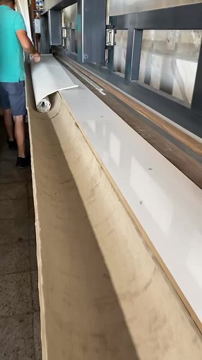 Industrial Machine Operation: Laminating Wood Surfaces