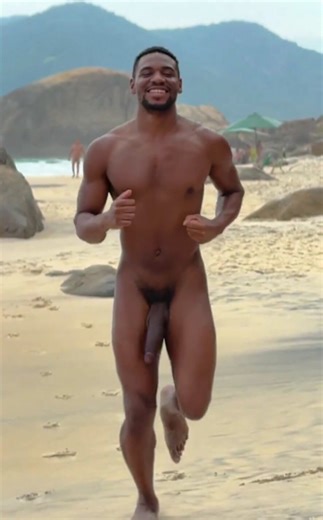Hung Black man running naked on nude beach