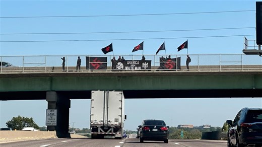 Group flying Swastika flag holds demonstration over St. Louis-area interstate