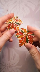 I mixed a bit of alcohol ink with polyurethane to fill the stained-glass sections in. You can also use UV resin for this! I've noticed that it's a lot easier to make accidental bubbles with polyurethane than with resin. 😬 #fallvibes #mapleleaf #polymerclaycutters | The Clay Impress