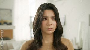 Upset female face of sad stressed hispanic girl with broken heart. Crying woman looking at camera with resentful offended facial expression worry about life problem. Series of face emotions close up