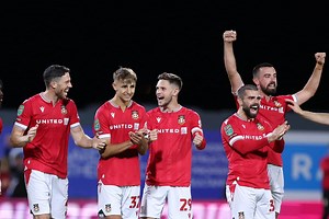 Wrexham’s double delight: Penalty win over Wigan and injured Mullin set to fly home from U.S.