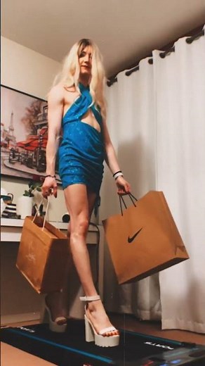 Bold and Beautiful: Crossdresser Stuns in Blue Mini Dress and Heels a Fashion-forward Look