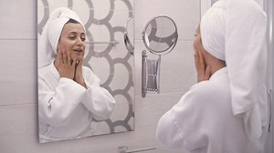 Woman saying positive affirmations to mirror - Free Stock Video