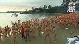1,000 naked revelers go swimming on the solstice