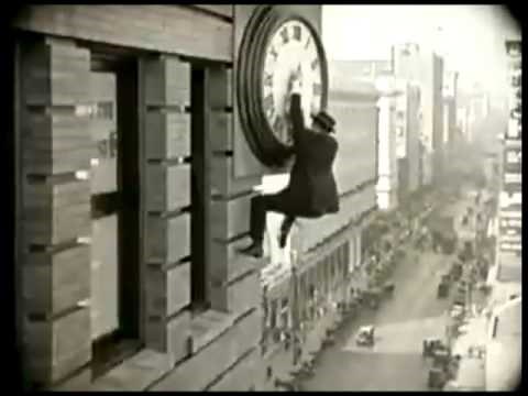Harold Lloyd, Safety Last (1923), hanging from a clock, humorinhistory.com