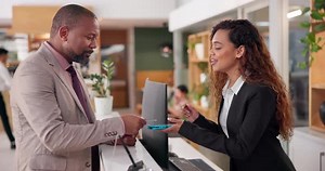 Credit card, service and concierge in hotel for payment, people and financial transaction