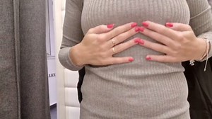 in the fitting room I flash my tits, the curtain is open