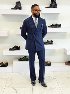 4.2K views · 58 reactions | Commanding presence in every stripe Navy Blue Pinstripe Double-Breasted, paired with a powder blue shirt, box-calf leather boots, broad peak lapels, structured Napoleon shoulders, and cuffed trousers delivering that timeless boardroom dominance. | Stanislaus A Akisah | Facebook