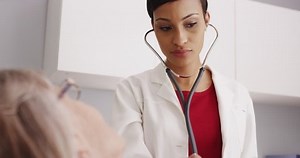 Young Attractive Doctor Listening Stethoscope Stock Footage Video (100% Royalty-free) 12836810 | Shutterstock