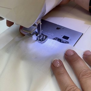 G is for Gathering! Attach a gathering foot. Select a straight stitch and increase the stitch length. Lightly place a finger behind the foot to start stitching as you get started. Tip: Increase upper thread tension to get more fullness in your gathers. Recommended for lightweight woven fabrics. #sewingatoz #itstartswithastitch #singersewingmachine #sewingtips #tipsandtricks | Singer Sewing
