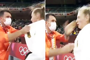 Judoka defends male coach slapping her cheeks and violently shaking her