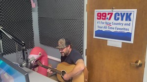 Big thanks to Cole Daniels of South River Strings for stopping by (with special appearance from Flamingo)! You can see him and Drew Pace perform this Friday at The 997 CYK 'Christmas in July' Ugly Sweater Soiree at Castle Hill Cider starting at 4PM! | 99.7 CYK